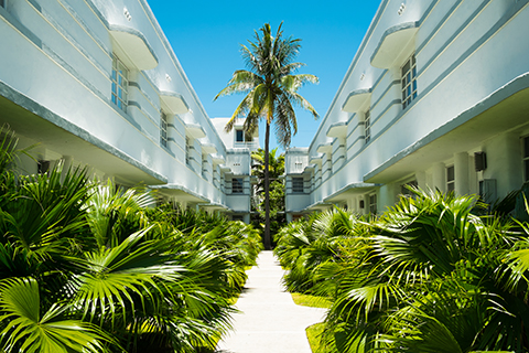 A stock photo of an art deco apartment community in Miami Beach, Florida.