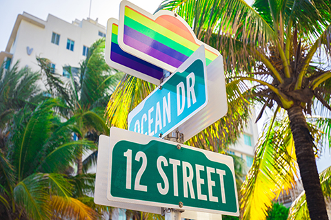 A stock photo of a street sign during the Miami Beach Pride Parade.